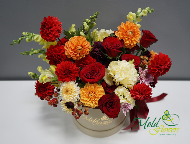 Box with red roses, dahlias, and eustoma photo